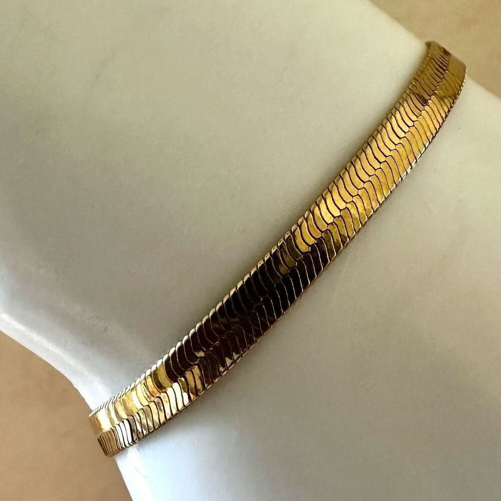 Gold tone flat herringbone bracelet